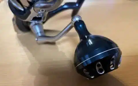 Upgrading Twin Power SW with Gomexus Power Knob 10 Fishing reel with attached component.