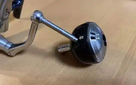 Upgrading Twin Power SW with Gomexus Power Knob 6 Fishing reel part angled on table