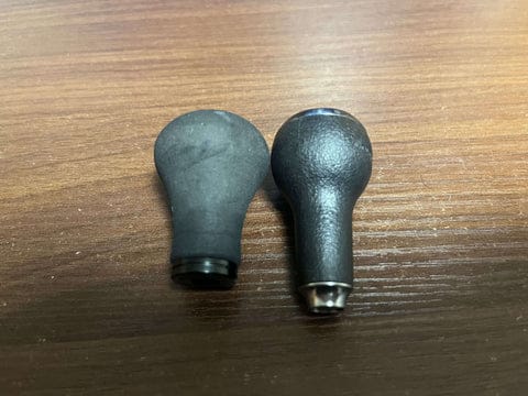 Two fishing reel handles side by side