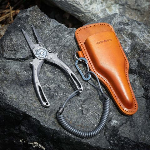 Fishing pliers with leather holster.