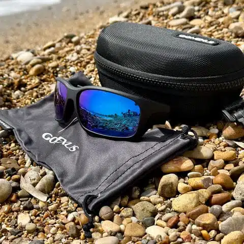 Sunglasses on a rocky beach.