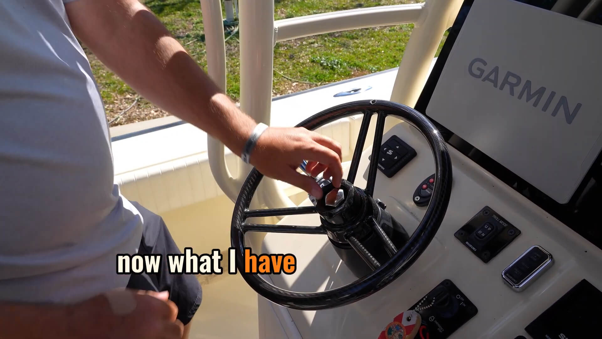 Boat steering wheel installation - Tightening boat steering wheel lock nut with socket wrench inside center concave